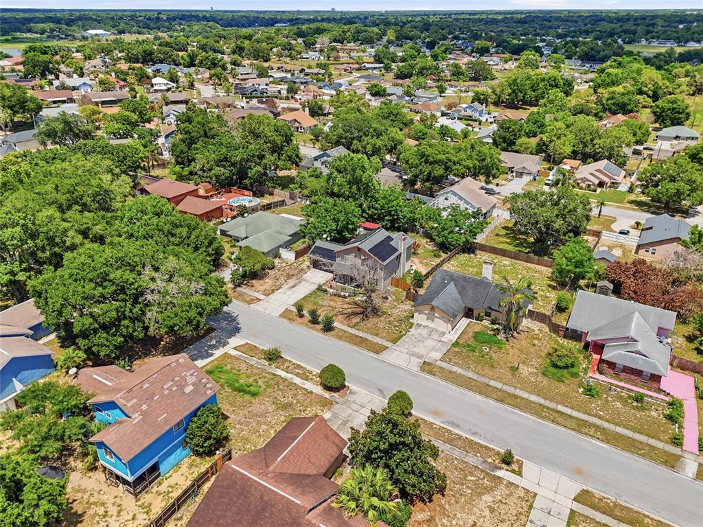 3027 Queens Gate Road Orlando, FL 32818 - Photo 6 of 6 an aerial view of residential houses with outdoor space