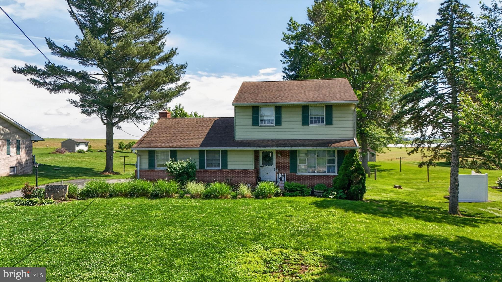 1106 Village Road Lancaster, PA 17602 - Photo 4 of 42 Charming home with lush green surroundings.
