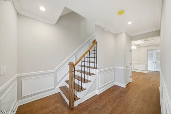 a view of an entryway with wooden floor