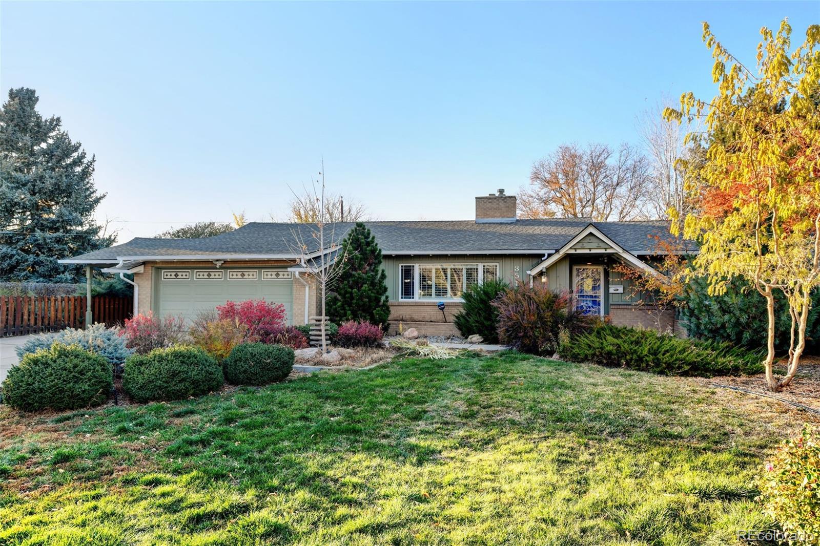 3515 Otis Street Wheat Ridge, CO 80033 - Photo 1 of 37 a front view of house with yard and trees around