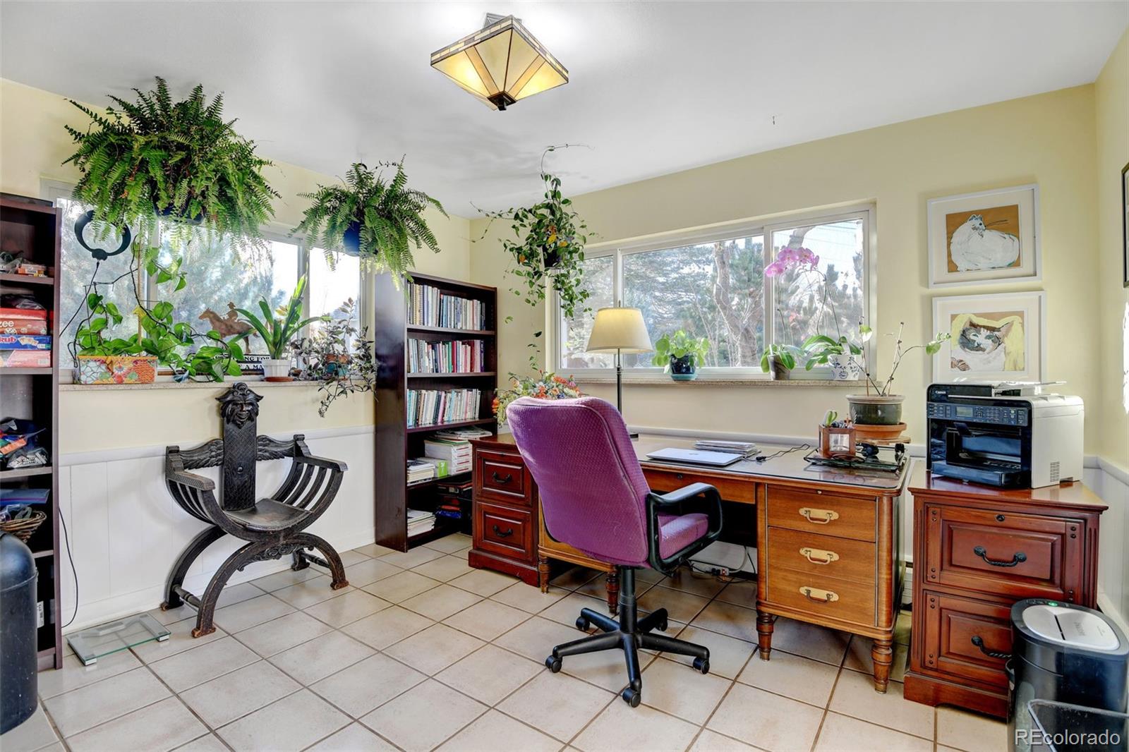 3515 Otis Street Wheat Ridge, CO 80033 - Photo 15 of 37 a view of a workspace with furniture and a potted plant