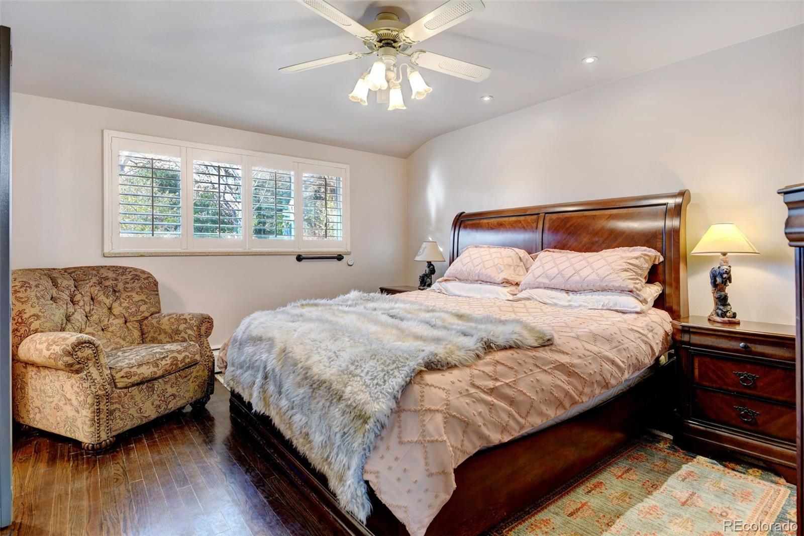3515 Otis Street Wheat Ridge, CO 80033 - Photo 16 of 37 a bedroom with bed and a couch