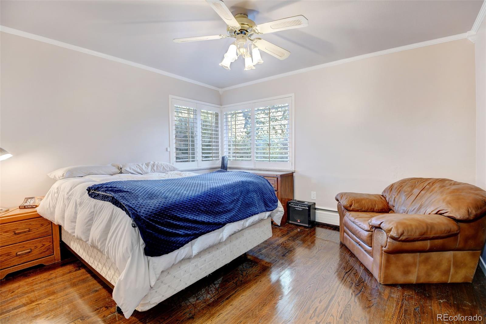 3515 Otis Street Wheat Ridge, CO 80033 - Photo 19 of 37 a bed room with a bed and a couch
