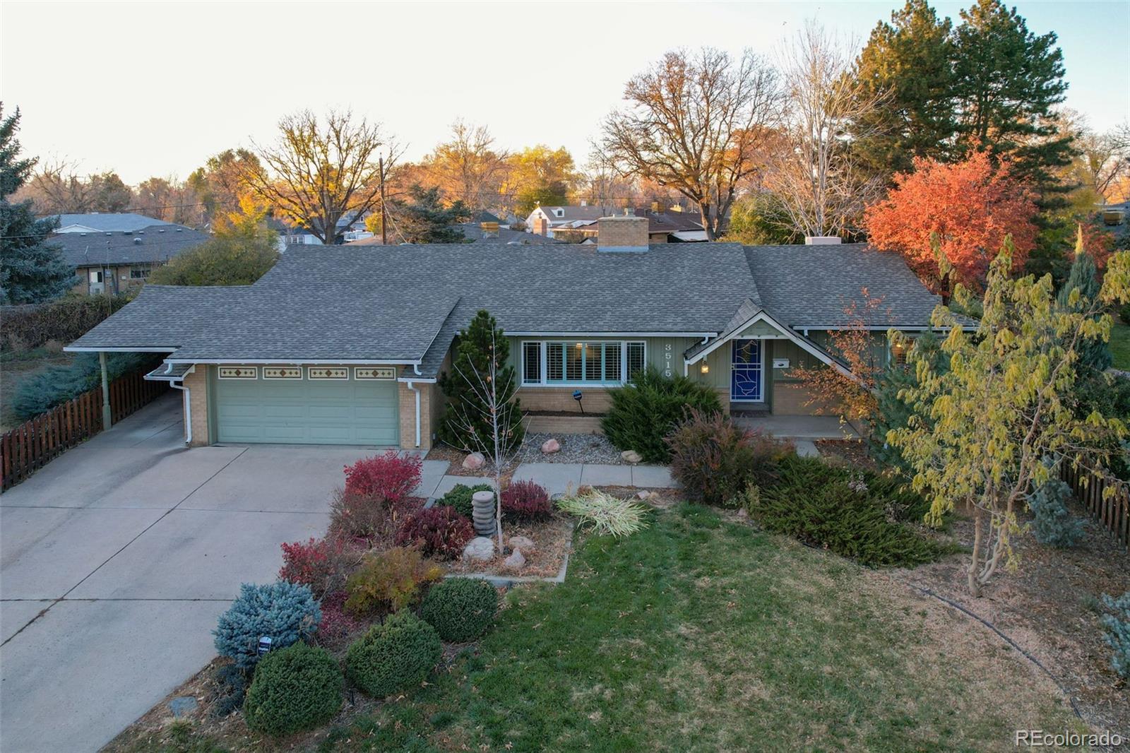 3515 Otis Street Wheat Ridge, CO 80033 - Photo 3 of 37 a front view of a house with table and chairs