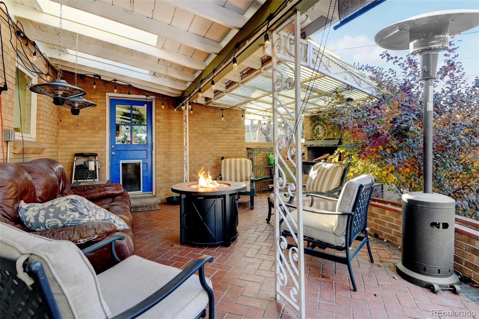 3515 Otis Street Wheat Ridge, CO 80033 - Photo 34 of 37 a outdoor living space with furniture and a fireplace