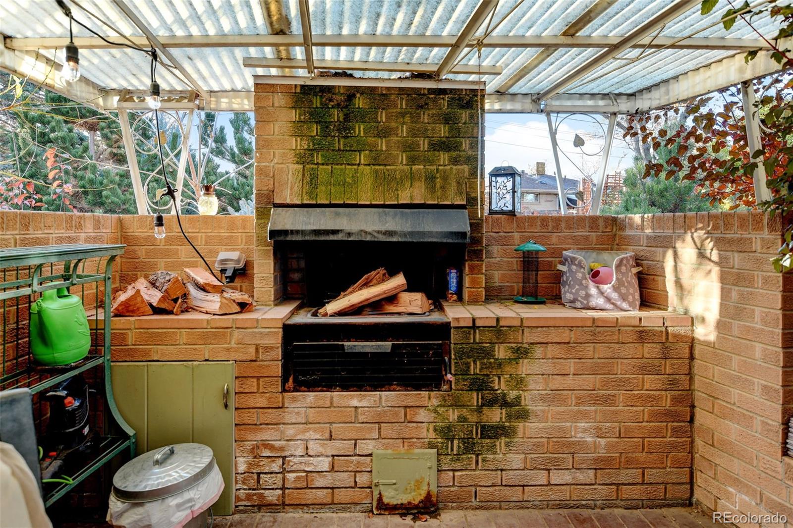 3515 Otis Street Wheat Ridge, CO 80033 - Photo 36 of 37 a stove top oven sitting inside of a kitchen