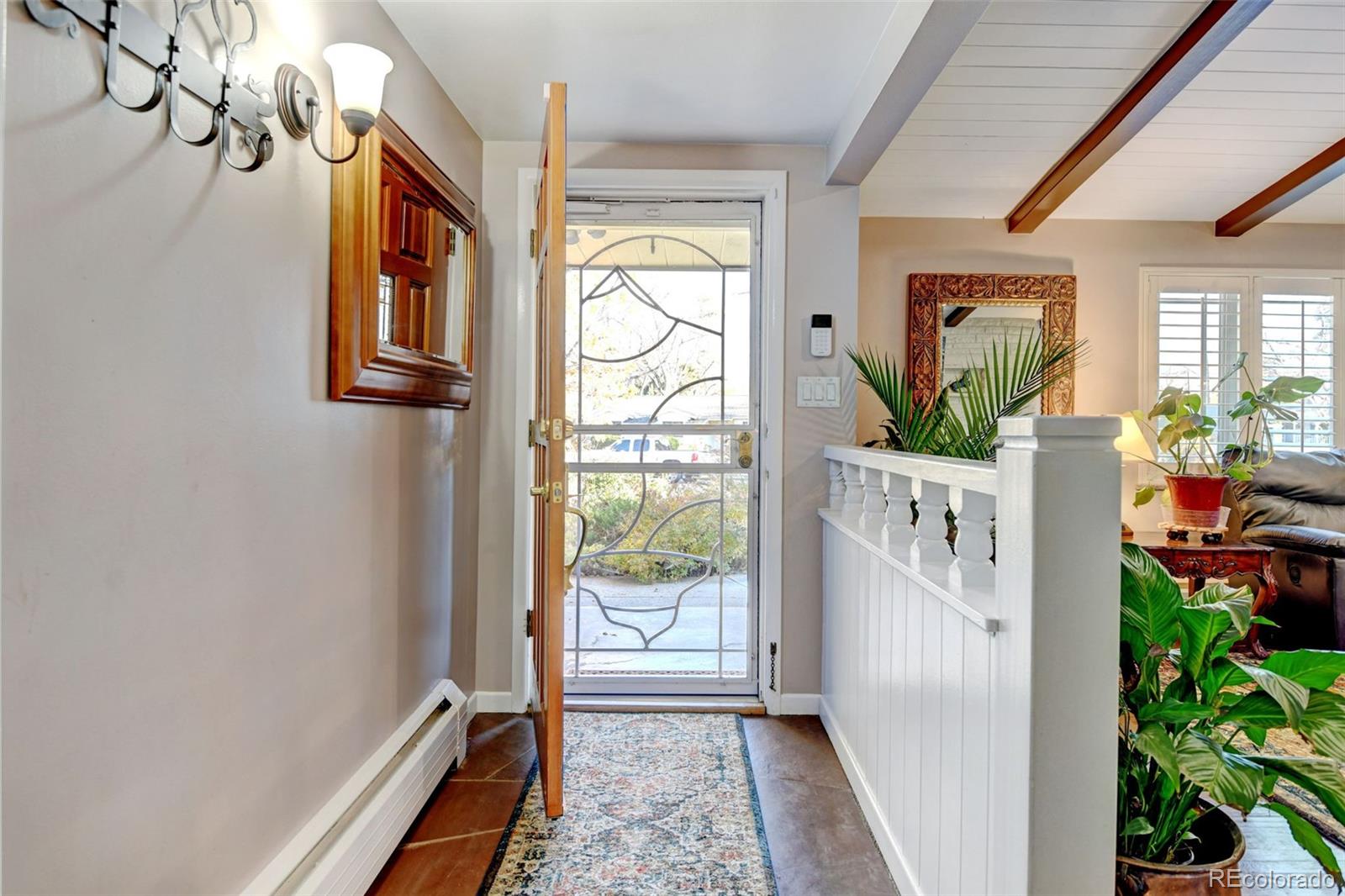 3515 Otis Street Wheat Ridge, CO 80033 - Photo 4 of 37 a view of an entryway with wooden floor
