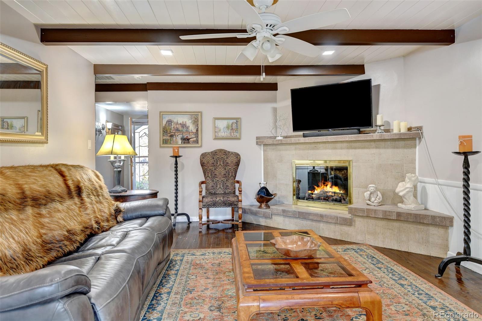 3515 Otis Street Wheat Ridge, CO 80033 - Photo 9 of 37 a living room with furniture and a flat screen tv