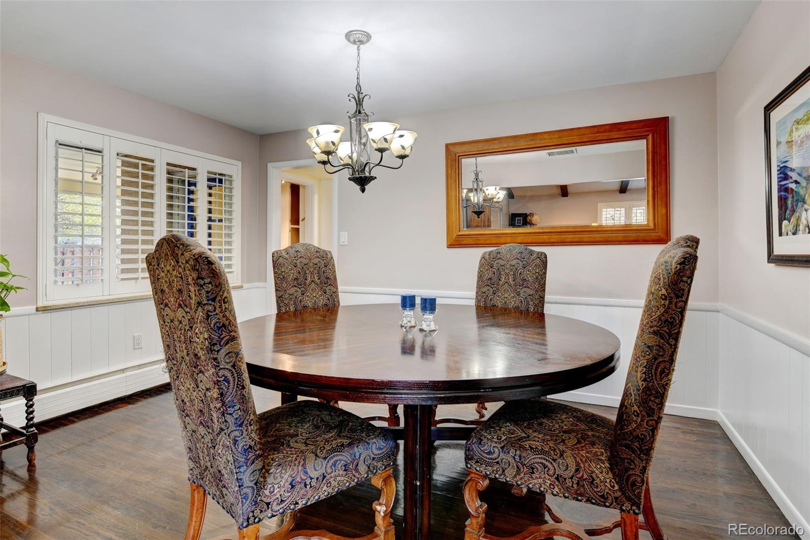 3515 Otis Street Wheat Ridge, CO 80033 - Photo 10 of 37 a view of a dining room with furniture window and wooden floor