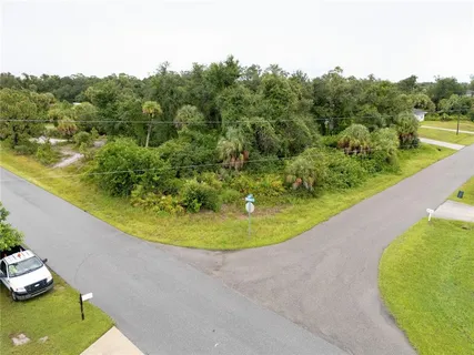 a view of a swimming pool with a yard