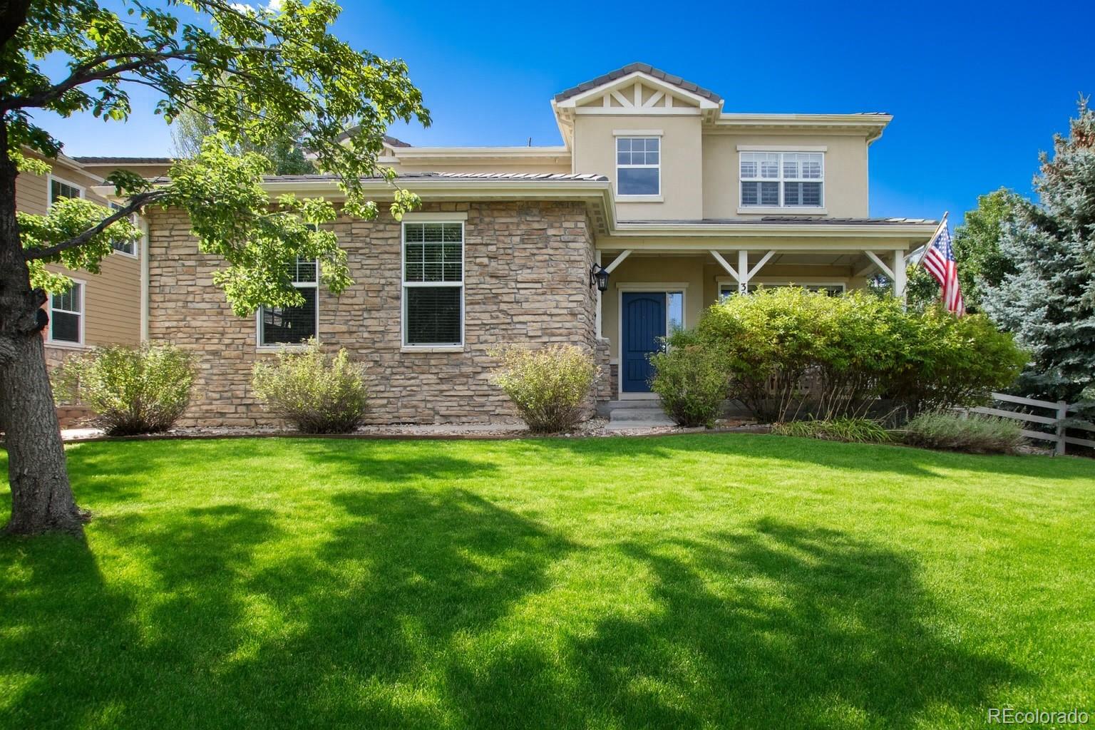 3064 Rams Horn Run Broomfield, CO 80023 - Photo 1 of 47 a front view of a house with a garden