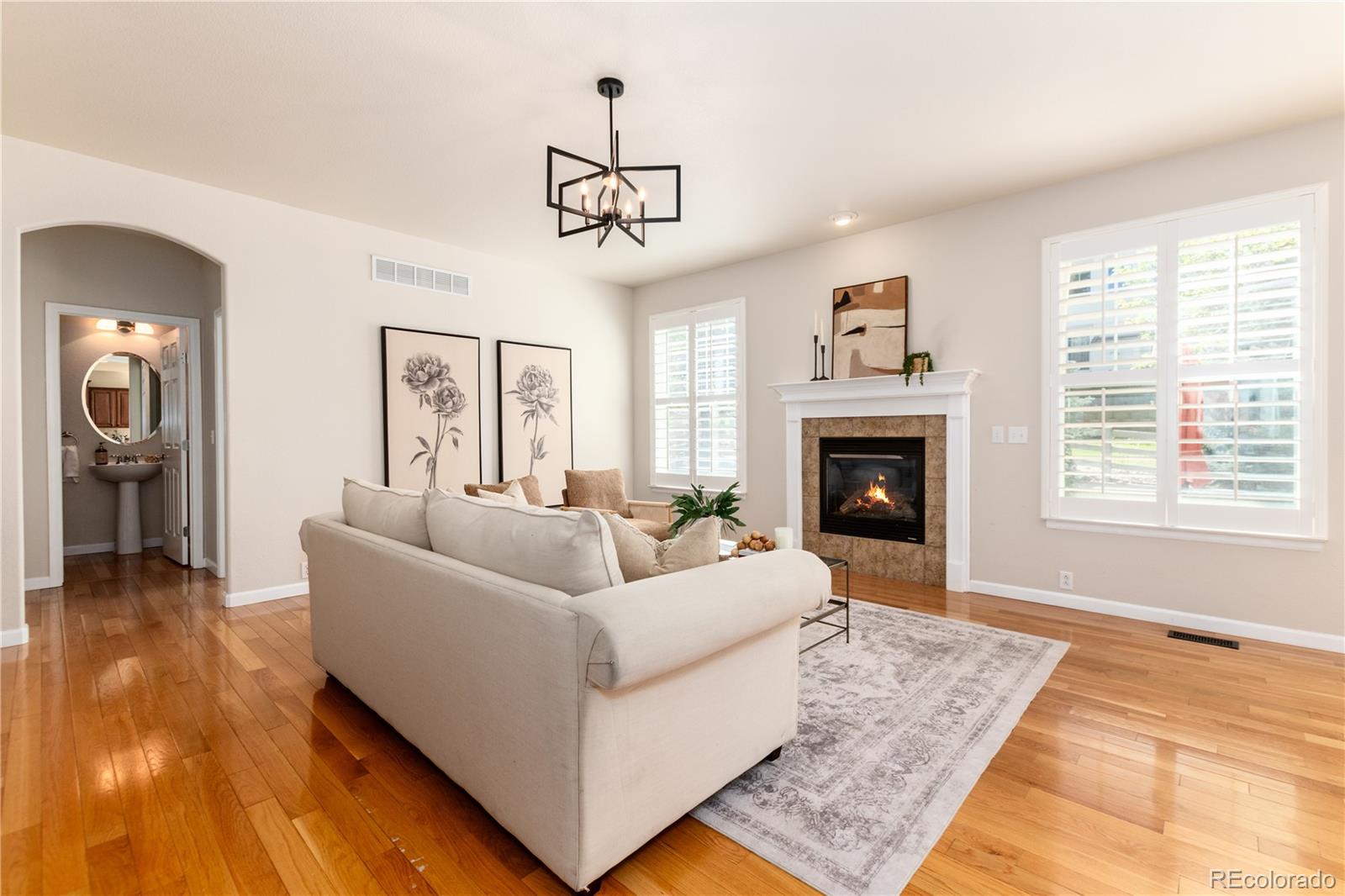3064 Rams Horn Run Broomfield, CO 80023 - Photo 17 of 47 a living room with furniture and a fireplace