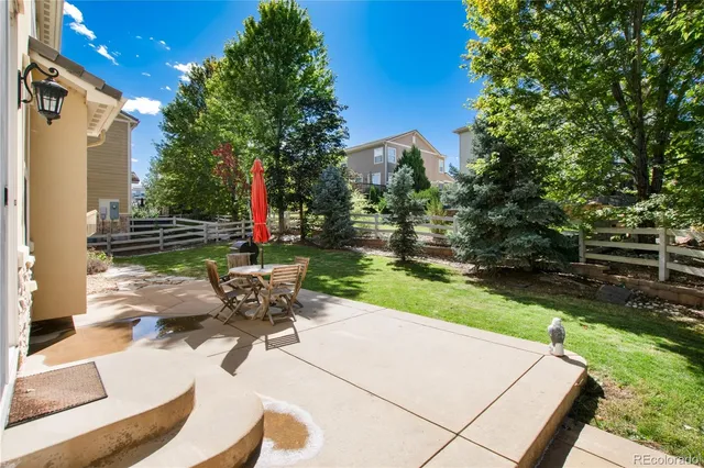 a view of a backyard with sitting area