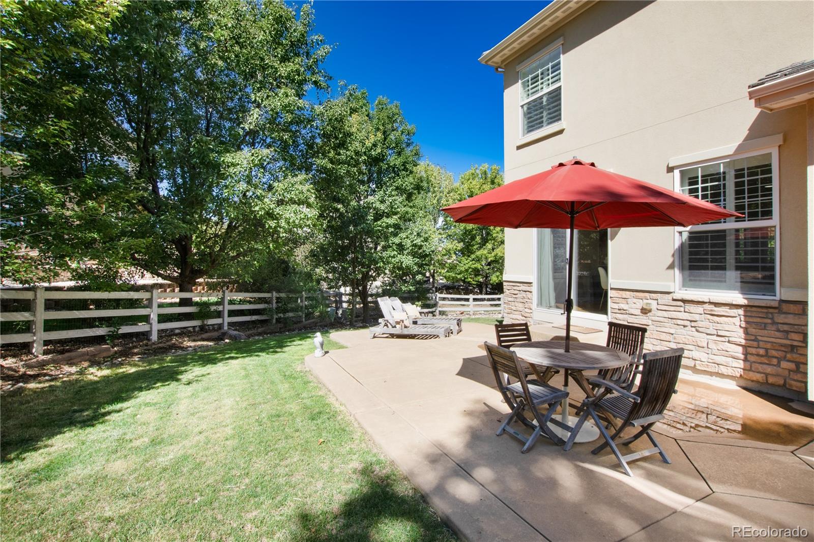 3064 Rams Horn Run Broomfield, CO 80023 - Photo 39 of 47 a view of a backyard with sitting area and furniture