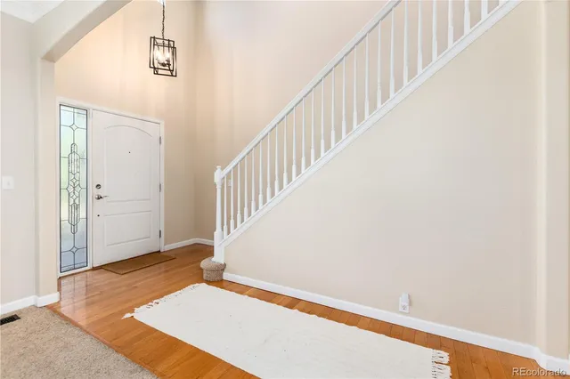 a view of an empty room with stairs