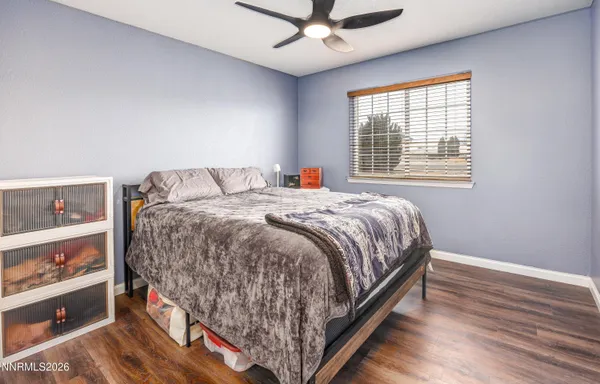 a bedroom with bed and a window