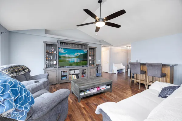 a kitchen with stainless steel appliances granite countertop a sink a stove and cabinets