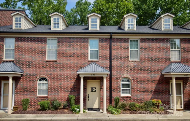 a front view of a building with garden