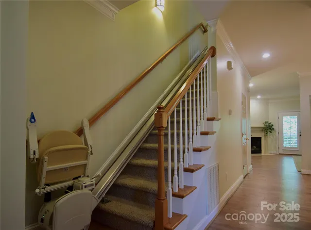 a view of entryway and hall with wooden floor