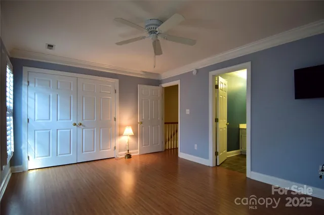 a bathroom with a sink a toilet a mirror and shower curtain