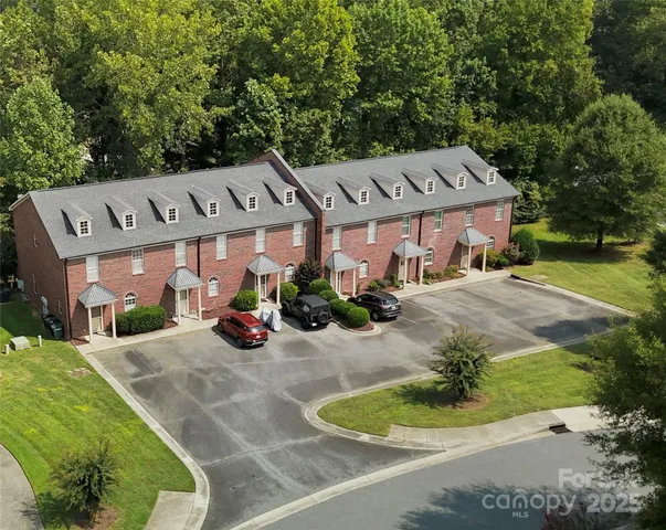 a view of a car park in front of house