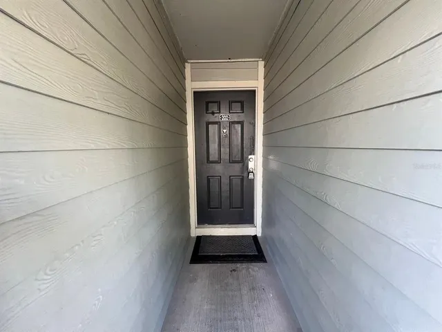 a view of outdoor space and wooden floor