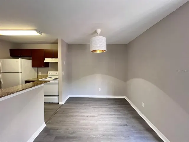 a bathroom with a sink a mirror and a shower