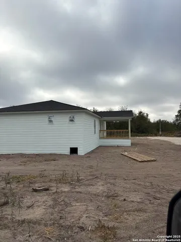 a view of a room with wooden walls