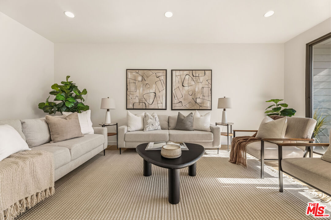 311 Bora Bora Way, Unit 3207 Marina del Rey, CA 90292 - Photo 5 of 54 a living room with furniture and a wooden floor