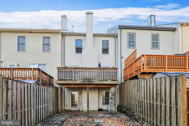 a front view of a house with iron stairs