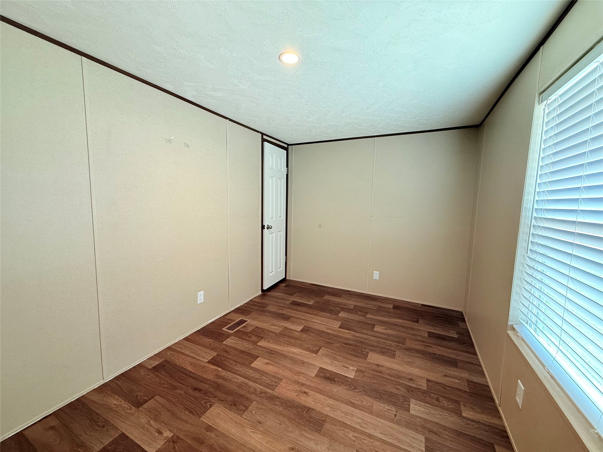 20470 Vick Drive, Unit 20440 New Caney, TX 77357 - Photo 15 of 17 a view of room with wooden floor