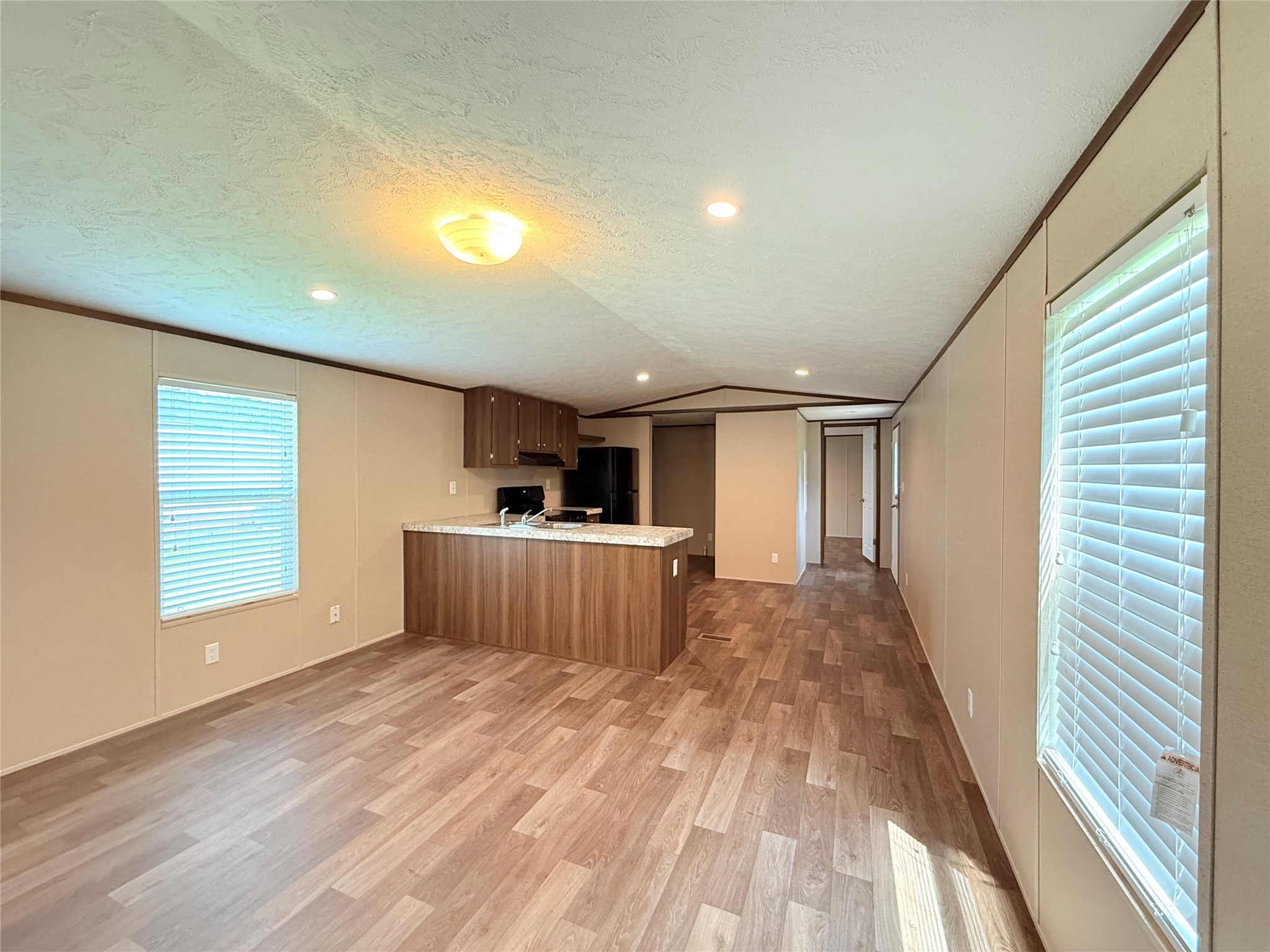 20470 Vick Drive, Unit 20440 New Caney, TX 77357 - Photo 4 of 17 a view of a room with a window and wooden floor