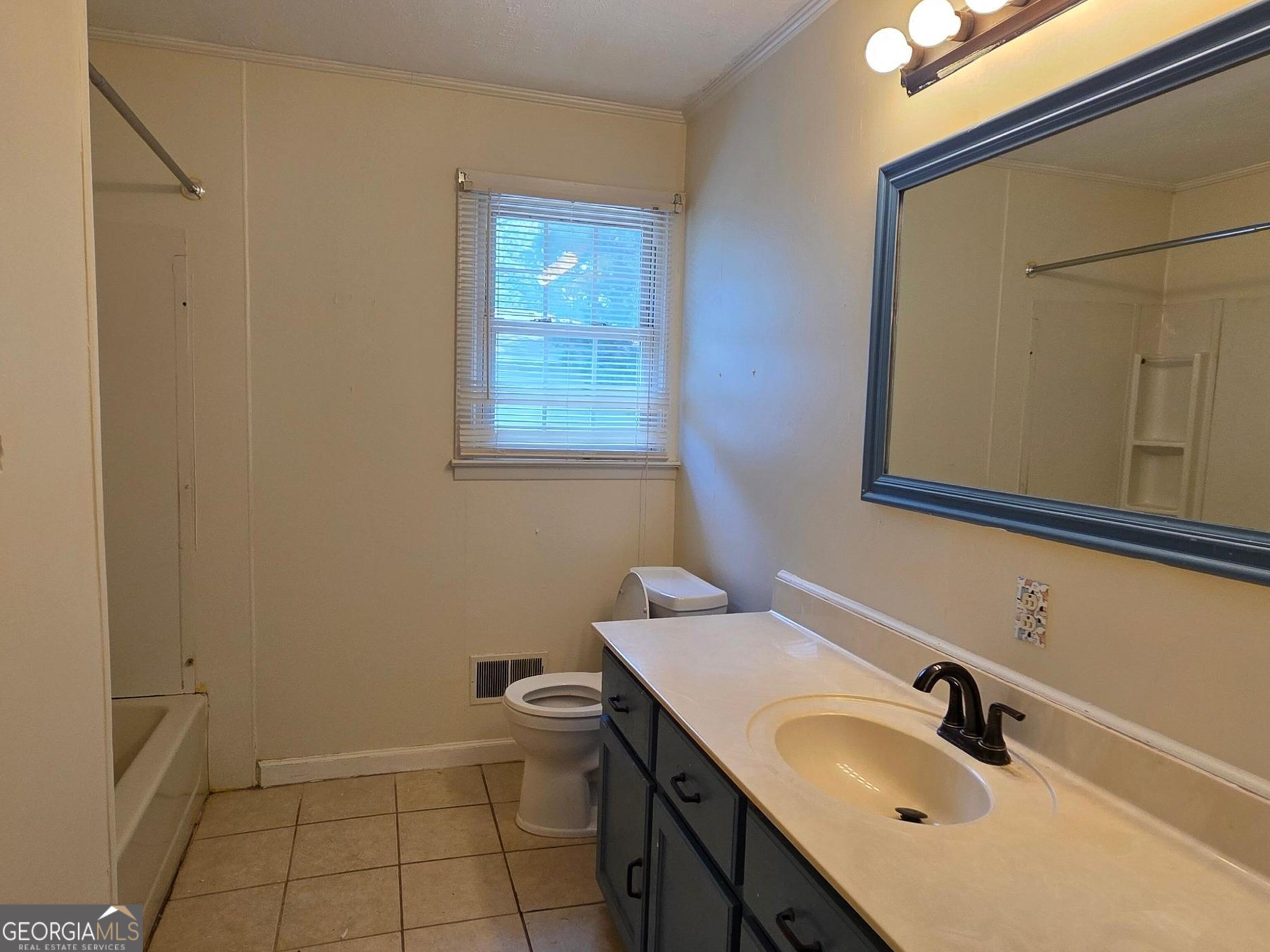 110 Lee Street Centerville, GA 31028 - Photo 10 of 16 a bathroom with a sink and a mirror