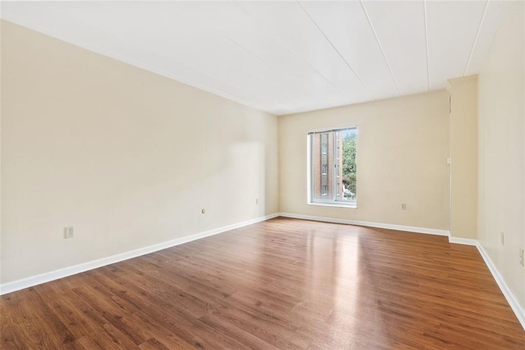 5 Bayard Road, Unit 416 Shadyside, PA 15213 - Photo 16 of 20 a view of an empty room with wooden floor and a window