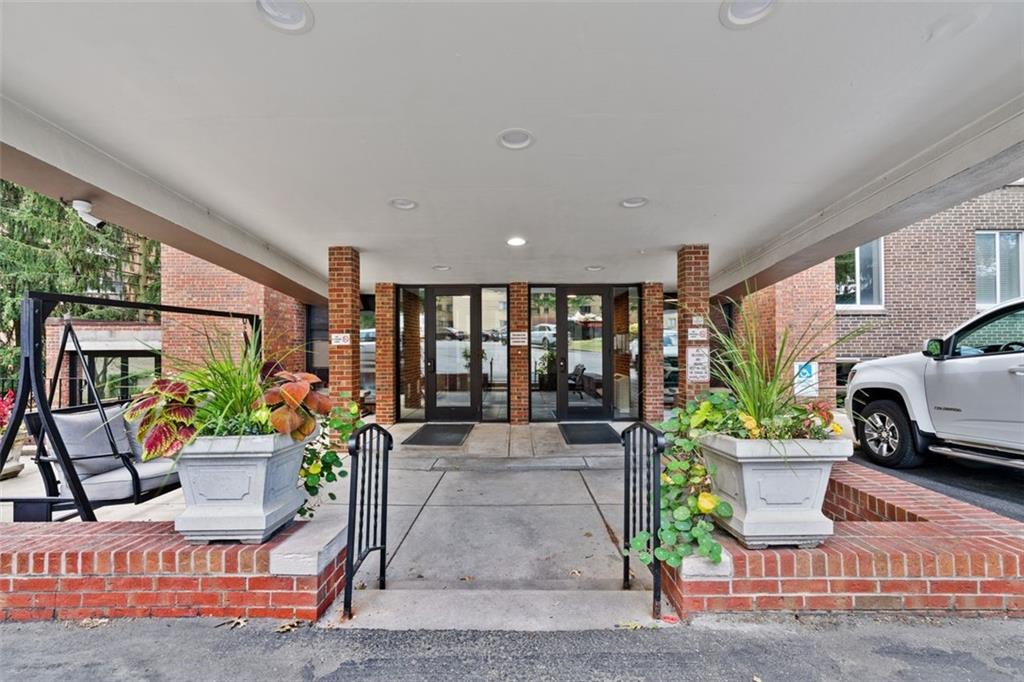 5 Bayard Road, Unit 416 Shadyside, PA 15213 - Photo 3 of 20 a living room with patio furniture and a potted plant