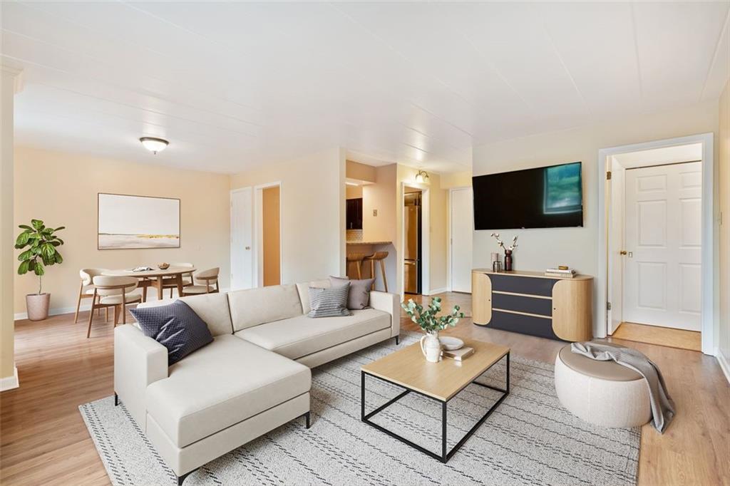 5 Bayard Road, Unit 416 Shadyside, PA 15213 - Photo 6 of 20 a living room with furniture and a flat screen tv