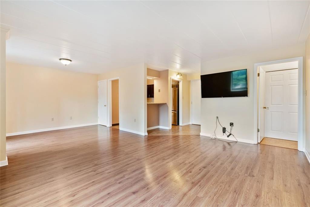 5 Bayard Road, Unit 416 Shadyside, PA 15213 - Photo 7 of 20 a view of a livingroom with wooden floor and a flat screen tv