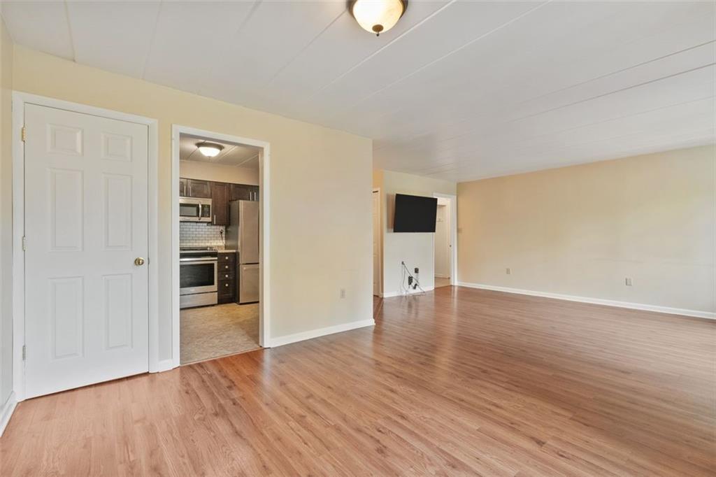 5 Bayard Road, Unit 416 Shadyside, PA 15213 - Photo 8 of 20 a view of an empty room with wooden floor and closet