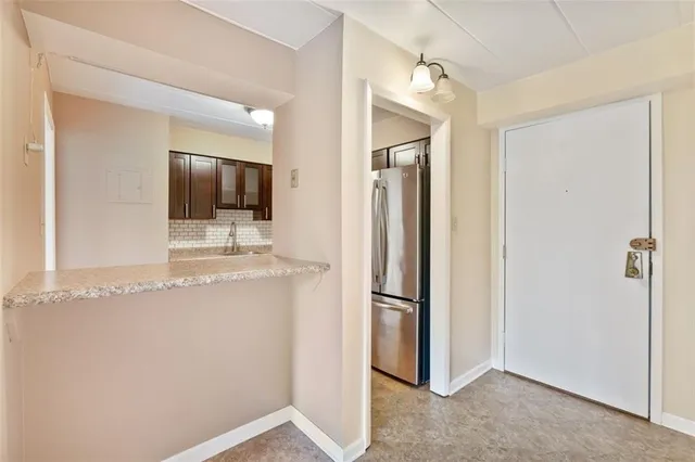 a view of a refrigerator in a kitchen
