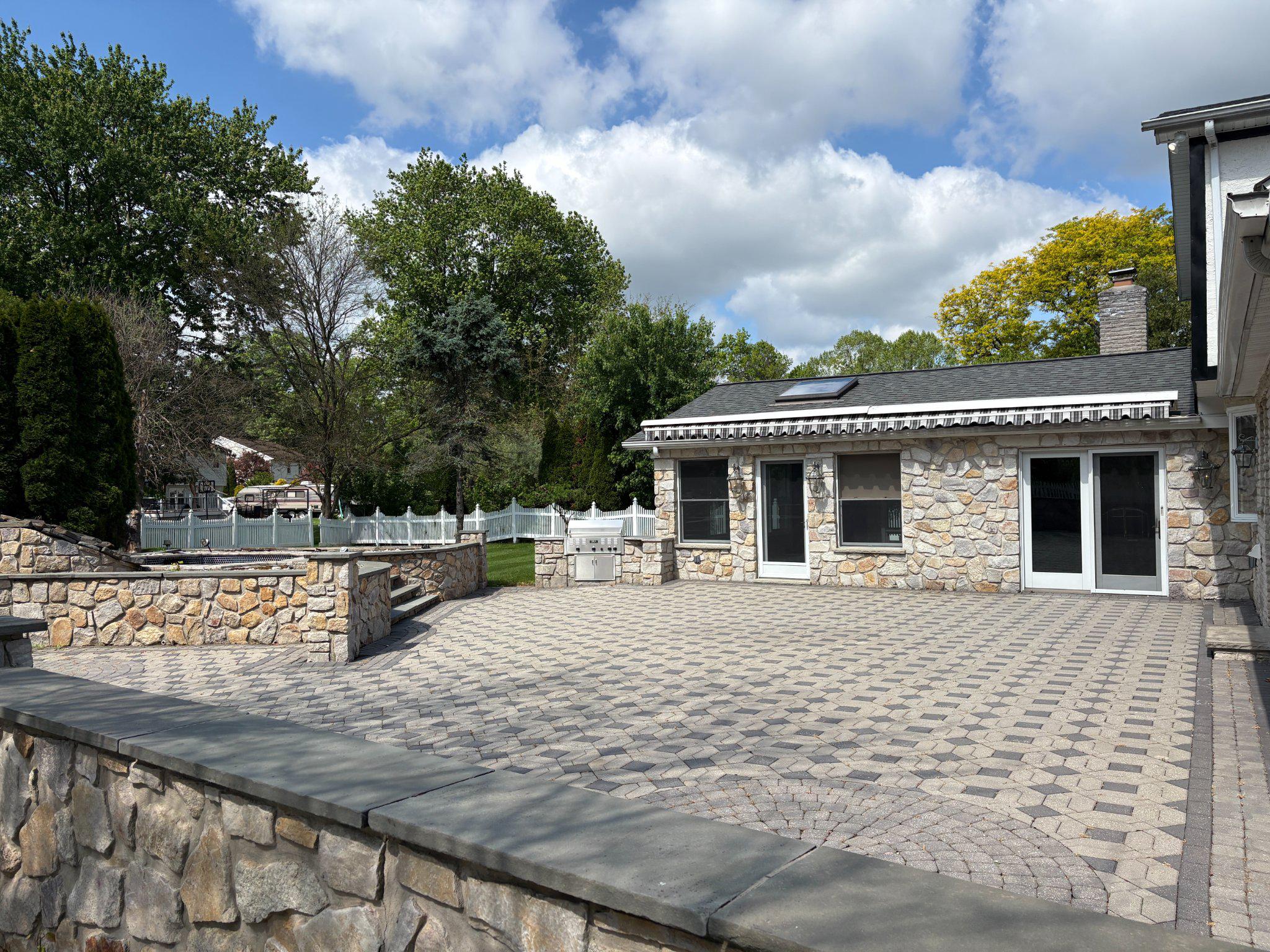 1021 Meetinghouse Road Ambler, PA 19002 - Photo 9 of 41 Spacious stone patio under blue skies.