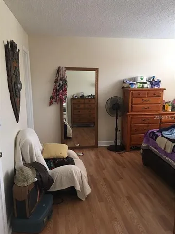 a white toilet sitting next to a shower curtain