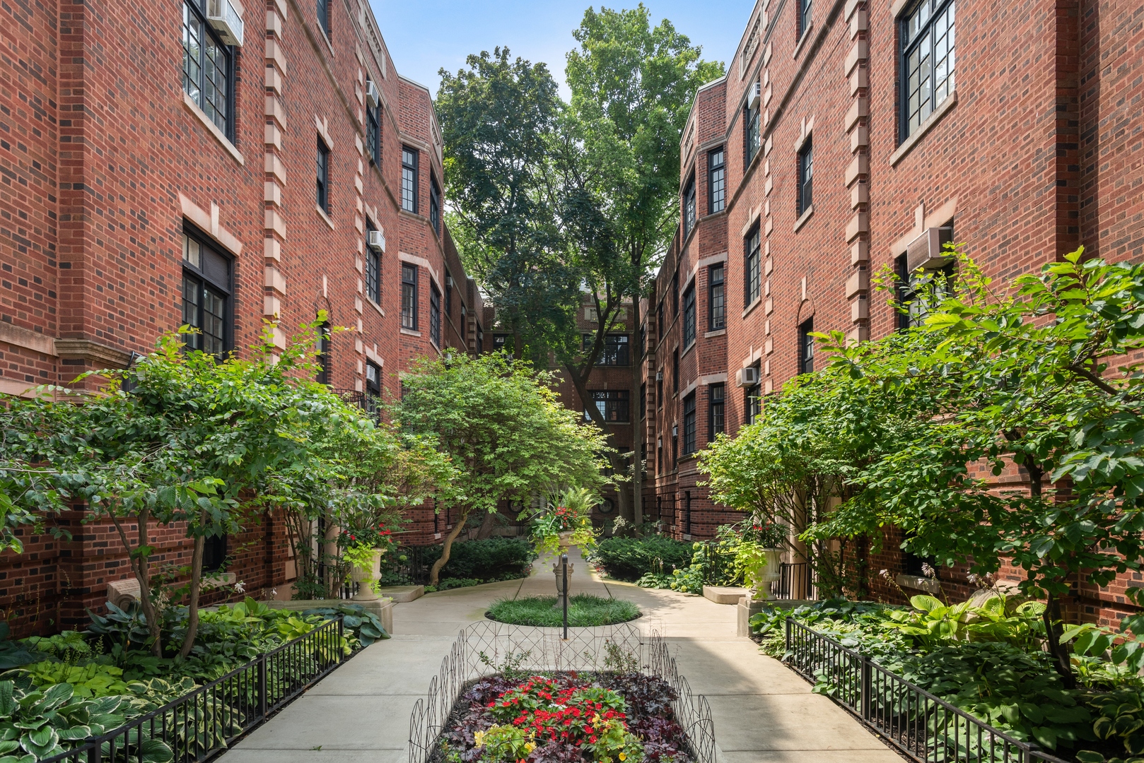 511 West Aldine Avenue, Unit 3F Chicago, IL 60657 - Photo 1 of 15 a street view with tall buildings and plants