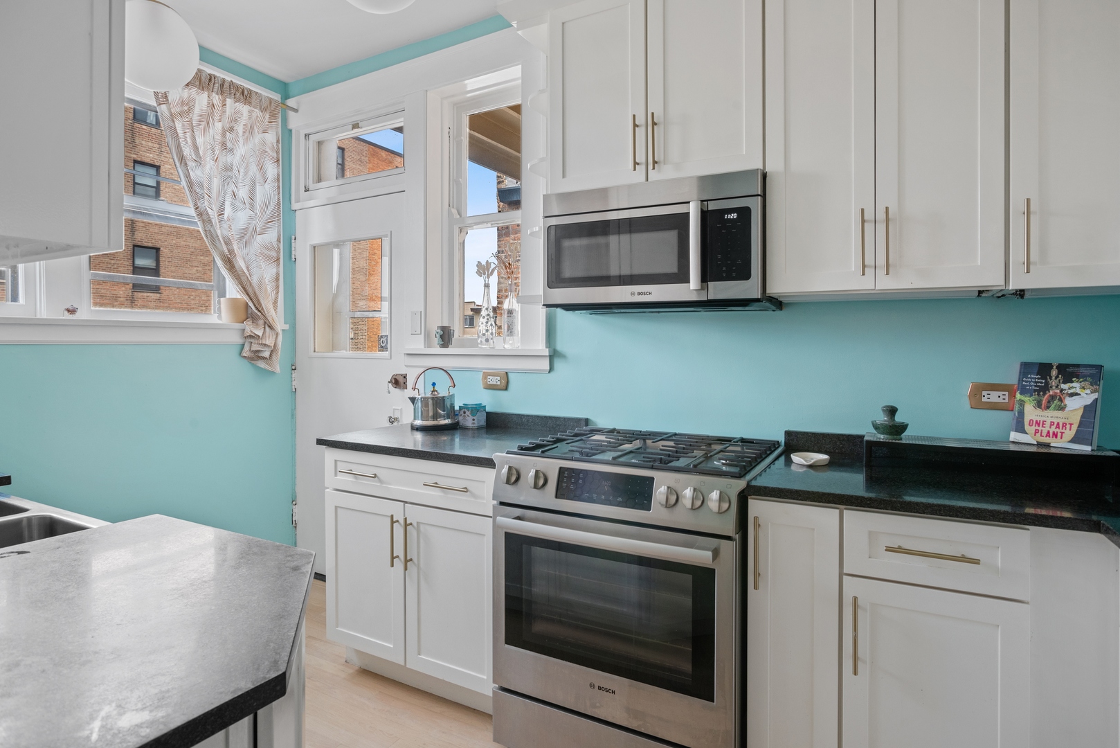 511 West Aldine Avenue, Unit 3F Chicago, IL 60657 - Photo 12 of 15 a kitchen with cabinets appliances and a sink