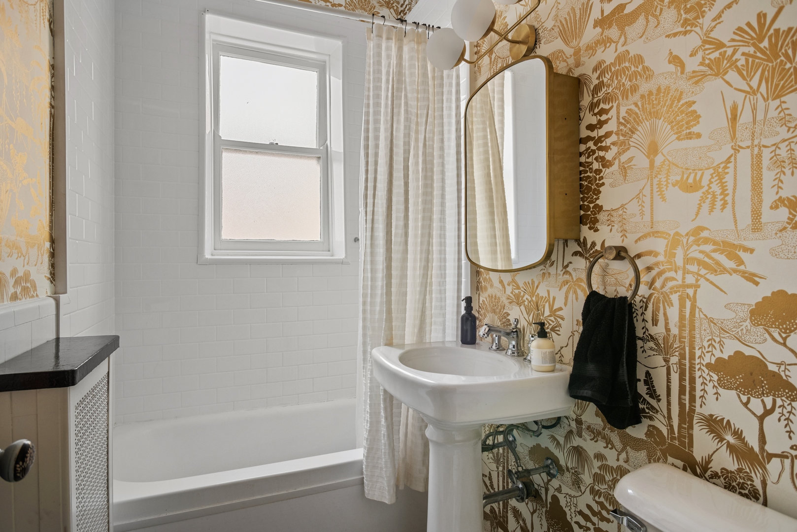 511 West Aldine Avenue, Unit 3F Chicago, IL 60657 - Photo 15 of 15 a bathroom with a sink vanity mirror and toilet