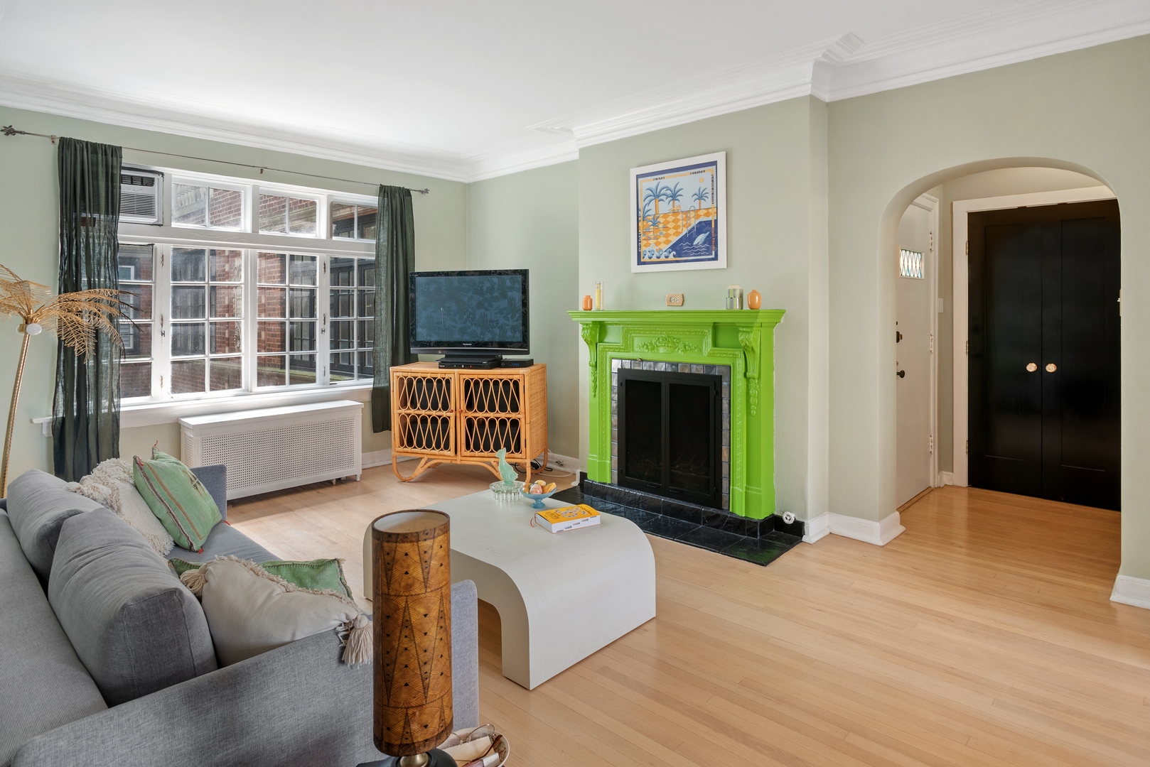 511 West Aldine Avenue, Unit 3F Chicago, IL 60657 - Photo 2 of 15 a living room with furniture and a fireplace