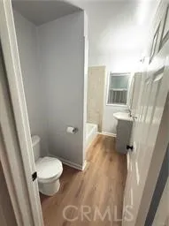 a bathroom with a sink toilet and tub