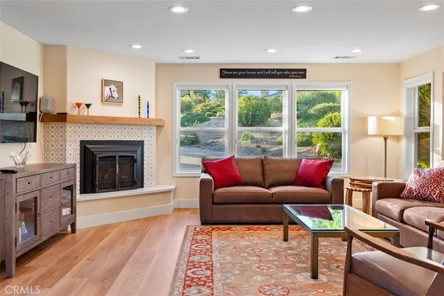 a view of a dining area with furniture window and wooden floor