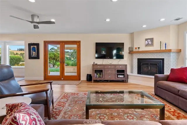 a kitchen with a table chairs sink and cabinets