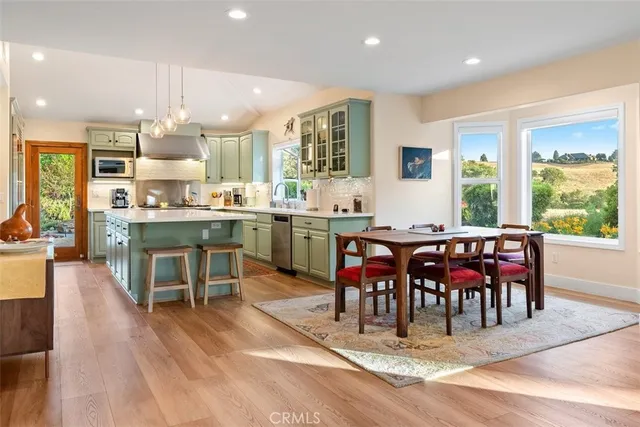 a kitchen with kitchen island a sink counter top space and a center island