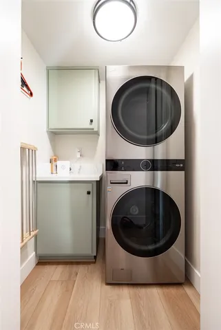 a spacious bedroom with a bed and a chandelier